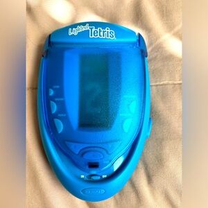 Vintage RADICA lighted TETRIS handheld game.‎   2003